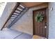 Exterior condo entry with stairs and a decorative wreath at 2200 S Fort Apache Rd # 1065, Las Vegas, NV 89117