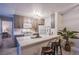 Modern kitchen with island, gray cabinets, and white countertops at 2200 S Fort Apache Rd # 1065, Las Vegas, NV 89117