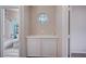 Small bathroom with linen cabinet and octagon window at 2214 Sexton Ave, North Las Vegas, NV 89031