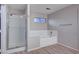 Bathroom features a shower, bathtub, and wood-look flooring at 2214 Sexton Ave, North Las Vegas, NV 89031