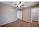 Well-lit bedroom with ceiling fan and ample closet space at 2214 Sexton Ave, North Las Vegas, NV 89031