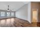 Bright bedroom with wood-look floors and ceiling fan at 2214 Sexton Ave, North Las Vegas, NV 89031