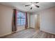 Spacious bedroom featuring a ceiling fan and large window at 2214 Sexton Ave, North Las Vegas, NV 89031