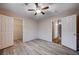 Well-lit bedroom with ample closet space and wood-look flooring at 2214 Sexton Ave, North Las Vegas, NV 89031