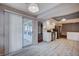 Bright kitchen features white cabinets, stainless steel appliances, and wood-look flooring at 2214 Sexton Ave, North Las Vegas, NV 89031