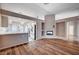 Open living room with wood-look floors and a fireplace at 2214 Sexton Ave, North Las Vegas, NV 89031