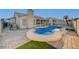 Resort-style pool and spa with brick pavers at 2214 Sexton Ave, North Las Vegas, NV 89031