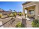 Landscaped backyard with patio and desert landscaping at 2408 Sky Watcher St, Henderson, NV 89044