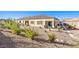 Large backyard with gravel, plants, and a patio at 2408 Sky Watcher St, Henderson, NV 89044