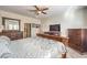 Main bedroom with king-size bed and en-suite bathroom access at 2408 Sky Watcher St, Henderson, NV 89044