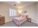 Cozy bedroom with a queen bed and window shutters at 2408 Sky Watcher St, Henderson, NV 89044