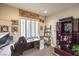 Home office features built-in shelving and a large window at 2408 Sky Watcher St, Henderson, NV 89044