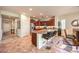 Kitchen with granite counters, stainless steel appliances, and dark wood cabinets at 2408 Sky Watcher St, Henderson, NV 89044