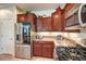 Modern kitchen with stainless steel appliances and granite countertops at 2408 Sky Watcher St, Henderson, NV 89044