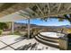 Backyard with a covered patio, a curved sitting area with stairs, and stunning views of the surrounding desert landscape at 2429 Anderson Park Dr, Henderson, NV 89044