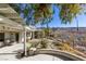 Covered patio, mountain views, and a nicely landscaped yard with desert plants at 2429 Anderson Park Dr, Henderson, NV 89044