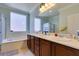 Bathroom with double sinks and large mirror at 2429 Anderson Park Dr, Henderson, NV 89044