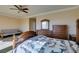 Bedroom with wood furniture and mountain view at 2429 Anderson Park Dr, Henderson, NV 89044