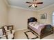 Bedroom showcasing neutral walls, ceiling fan, and a large bed with a quilted bedspread and light neutral carpet at 2429 Anderson Park Dr, Henderson, NV 89044
