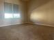 Simple bedroom featuring neutral carpeting and a window offering natural light at 2429 Anderson Park Dr, Henderson, NV 89044