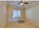 Spacious bedroom with ceiling fan and neutral carpeting at 2429 Anderson Park Dr, Henderson, NV 89044