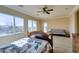 Bedroom featuring neutral carpeting, ceiling fan, and a view of the landscape at 2429 Anderson Park Dr, Henderson, NV 89044