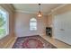 Charming breakfast nook with stained wood cabinets and decorative chandelier at 2429 Anderson Park Dr, Henderson, NV 89044