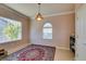 Bright breakfast nook with stained wood cabinets and decorative chandelier at 2429 Anderson Park Dr, Henderson, NV 89044