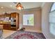 Bright breakfast nook with stained wood cabinets and decorative chandelier at 2429 Anderson Park Dr, Henderson, NV 89044