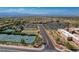 An aerial view shows tennis courts, bocce, roads, parking, desert landscaping, and buildings at 2429 Anderson Park Dr, Henderson, NV 89044