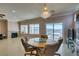 Bright dining area with a wooden table and chairs, fireplace, and scenic views at 2429 Anderson Park Dr, Henderson, NV 89044