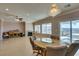 Bright dining area with a wooden table and chairs, fireplace and scenic views at 2429 Anderson Park Dr, Henderson, NV 89044