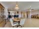 Elegant dining area features a crystal chandelier and is open to the kitchen and living spaces at 2429 Anderson Park Dr, Henderson, NV 89044