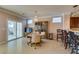 Elegant dining area with chandelier, adjacent to kitchen with breakfast bar at 2429 Anderson Park Dr, Henderson, NV 89044