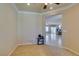 Neutral spare room with a carpeted floor and a peek into a dining room with tile floors at 2429 Anderson Park Dr, Henderson, NV 89044