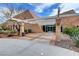 Modern building entrance with glass doors, stylish architectural accents, and desert landscaping at 2429 Anderson Park Dr, Henderson, NV 89044