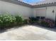 Home exterior with desert landscaping, featuring rock and concrete, with a light fixture at 2429 Anderson Park Dr, Henderson, NV 89044