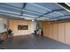 Garage featuring epoxy flooring and built-in cabinets for storage and organization with overhead lighting at 2429 Anderson Park Dr, Henderson, NV 89044