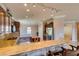 Kitchen with granite countertops, wooden cabinets and breakfast bar at 2429 Anderson Park Dr, Henderson, NV 89044