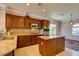 Well-equipped kitchen features stainless steel appliances, granite countertops, a kitchen island, and ample storage at 2429 Anderson Park Dr, Henderson, NV 89044