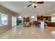 Open kitchen with island, breakfast bar, and dark wood cabinets at 2429 Anderson Park Dr, Henderson, NV 89044