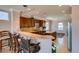 Gourmet kitchen boasts a breakfast bar, granite countertops, stainless appliances, and ample cabinet space at 2429 Anderson Park Dr, Henderson, NV 89044