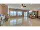 Bright living room with tile floors, a fireplace, dining area, and scenic views at 2429 Anderson Park Dr, Henderson, NV 89044