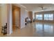 Bright living room featuring tile floors, a fireplace, and scenic views from large windows at 2429 Anderson Park Dr, Henderson, NV 89044