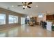 Open-concept living area with tile floors connecting to a dining area and kitchen at 2429 Anderson Park Dr, Henderson, NV 89044
