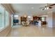 Bright living space featuring tile floors, a dining area with chandelier, and seamless access to the kitchen at 2429 Anderson Park Dr, Henderson, NV 89044