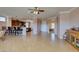 Expansive living space with tile flooring is open to the kitchen and adjacent rooms, offering a modern feel at 2429 Anderson Park Dr, Henderson, NV 89044