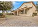 Spacious backyard with covered patio, putting green, and gravel landscaping at 2571 Hazelburn Ave, Henderson, NV 89044