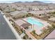 Relaxing community pool with lounge chairs and shaded seating areas at 2571 Hazelburn Ave, Henderson, NV 89044