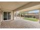 Covered patio with brick pavers and sliding glass door access at 2571 Hazelburn Ave, Henderson, NV 89044